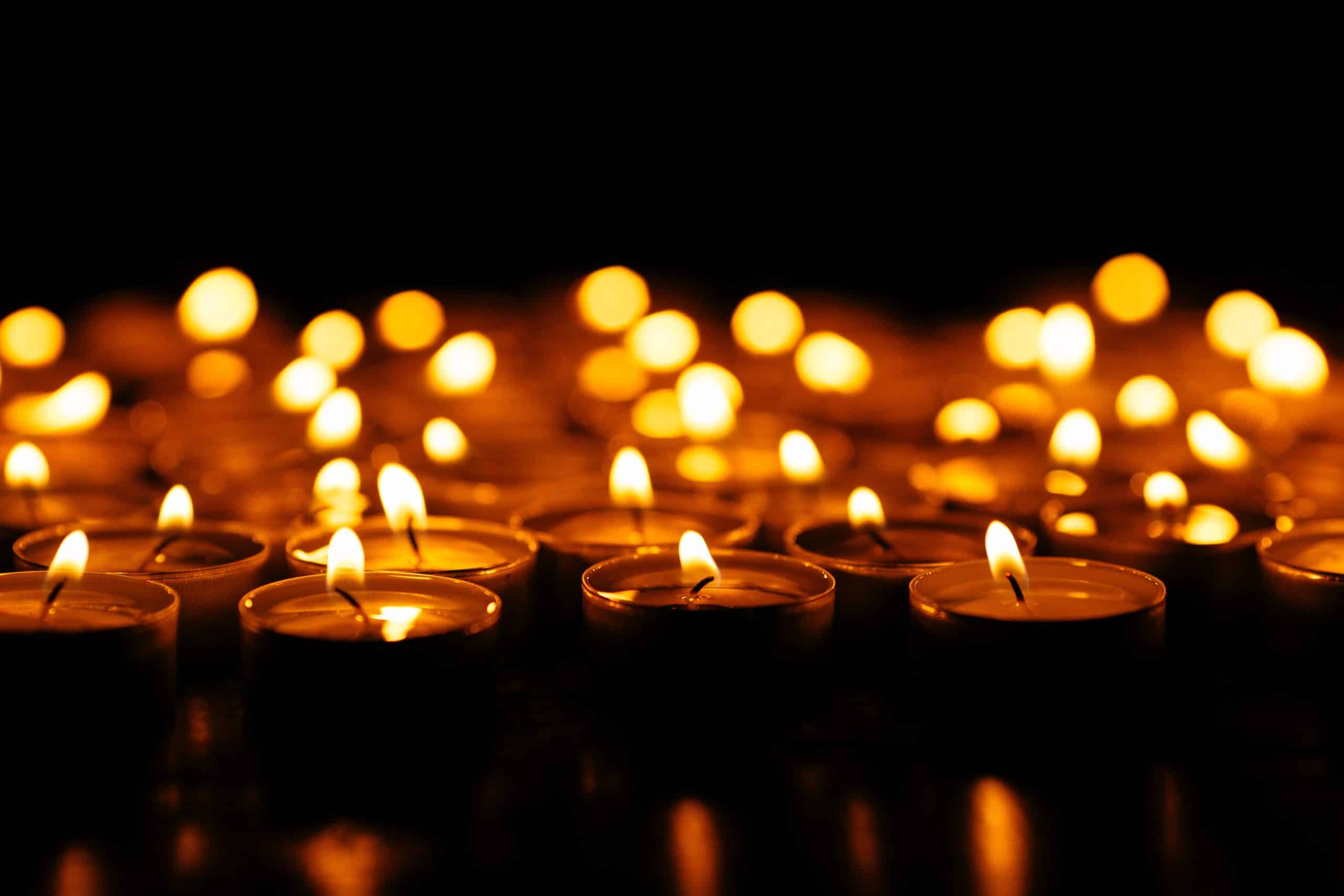 Candles. Set of lighting candles in dark. Selective focus